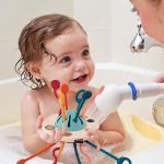 Montessori UFO Silicone Pulling String Toy - الصورة 8